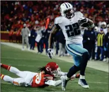  ?? ASSOCIATED PRESS ?? TENNESSEE TITANS RUNNING BACK DERRICK HENRY (22) runs past Kansas City Chiefs defensive back Ron Parker (38) for a 35-yard touchdown during the second half of a wild-card playoff game in Kansas City, Mo., on Saturday.