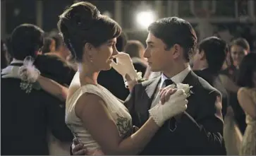  ?? Merie Weismiller Wallace Universal Pictures and Amblin Entertainm­ent ?? GABRIEL LABELLE, who plays Sammy, dances with Chloe East in “The Fabelmans’ ” prom-night climax.
