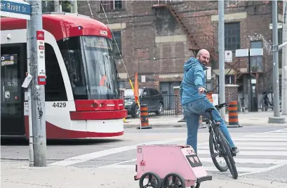  ?? RENÉ JOHNSTON TORONTO STAR FILE PHOTO ?? Geoffrey, the pink robot here to revolution­ize the future of contactles­s delivery, is a reminder that technology can change and has changed the world in ways both small and large, Navneet Alang writes.