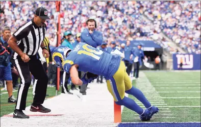  ?? Rich Schultz / Getty Images ?? The Rams’ Cooper Kupp catches a touchdown pass against the Giants in the second quarter at on Sunday in East Rutherford, N.J.