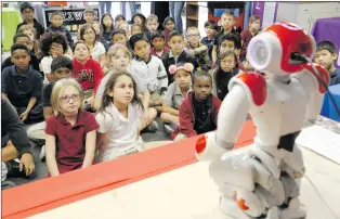  ?? Nikolas Samuels/The Signal (See additional photos on signalscv.com) ?? Third-grade students watch a robot move around during a special assembly at Albert Einstein Academy in Valencia on Wednesday.