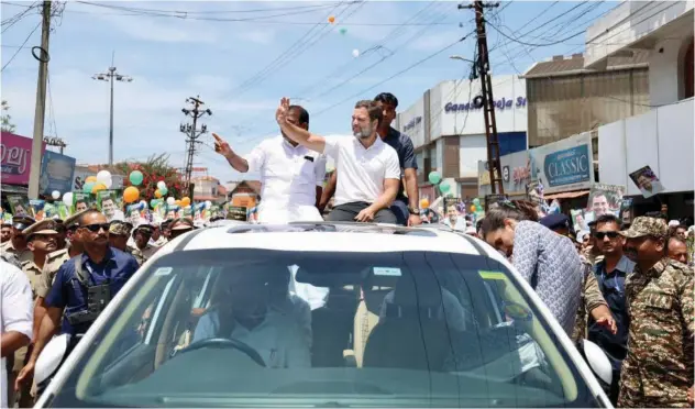  ?? Photo: Ashraf Padanna ?? ↑ Rahul Gandhi waves to supporters during a road show in Wayanad, Kerala.