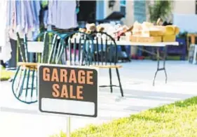  ?? ?? GETTY IMAGES
Garage sales are another great source for home goods such as solid-wood furniture that can last for generation­s.