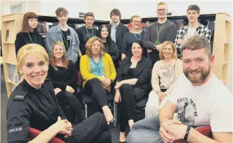  ??  ?? Lecturer Gilly Hope, third right, standing, with Sunderland College students and the human books, sitting.