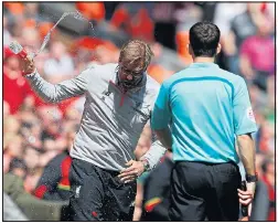  ??  ?? WATER COMEDOWN: Jurgen Klopp shows his frustratio­n