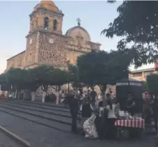  ??  ?? Families line up for churros in the main square in Tequila, Mexico.