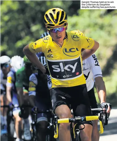  ??  ?? Geraint Thomas held on to win the Criterium du Dauphine despite suffering two punctures