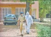  ?? PTI ?? An ED official wearing a PPE suit raids the farmhouse and n residence of Agrasain Gehlot, brother of CM Ashok Gehlot.
