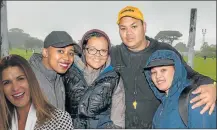  ?? Picture: MARK WEST ?? PLAYING IN THE RAIN: Guests, from left, Sisanda Simoyi, Tamlin Marais, Kyle Reid and Stephanie Arends attended the BLC Attorneys charity soccer day at St George’s Park last weekend