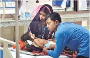  ?? PHOTO: PTI FILE ?? A couple attends to their ailing child in the neonatal ward at Baba Raghav Das Medical College in Gorakhpur