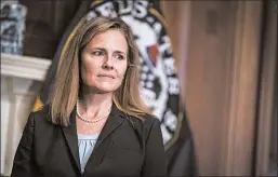  ?? SARAH SILBIGER/AP ?? Judge Amy Coney Barrett met with senators on Wednesday on Capitol Hill in Washington. Hearings for the Supreme Court nominee to replace Ruth Bader Ginsburg begin Oct. 12.