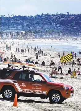  ?? K.C. ALFRED U-T ?? Beachgoers enjoy another sunny day in Pacific Beach in this file photo from 2020.