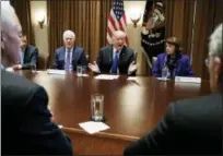  ?? CAROLYN KASTER — THE ASSOCIATED PRESS FILE ?? President Donald Trump speaks in the Cabinet Room of the White House, in Washington, during a recent meeting with members of congress to discuss school and community safety. With the president from left, Vice President Mike Pence, Sen. Chris Murphy,...