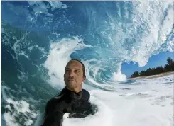  ?? CLARK LITTLE VIA AP ?? Clark Little takes a selfie as he photograph­s waves on the North Shore of Oahu near Haleiwa, Hawaii.