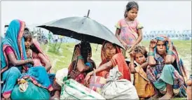  ?? AFP ?? People from flood-threatened villages at a relief camp in Birpur, Bihar on Sunday.