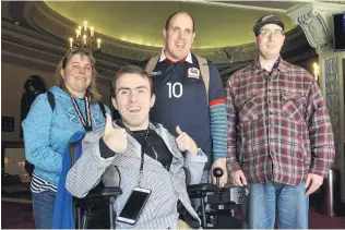  ?? PHOTO: GERARD O’BRIEN ?? Making friends . . . Enabling Love chief executive officer Joshua Perry (front) and members (from left) Robyn Harrison, Danny Sapsforde and Philip Lomas relished the chance to attend a film at the Regent Theatre yesterday.