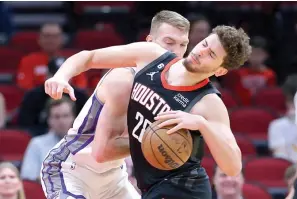  ?? (AP photo/Michael Wyke) ?? Houston Rockets center Alperen Sengun, right, tries to drive around Sacramento Kings forward Domantas Sabonis, left, Monday during a basketball game in Houston.