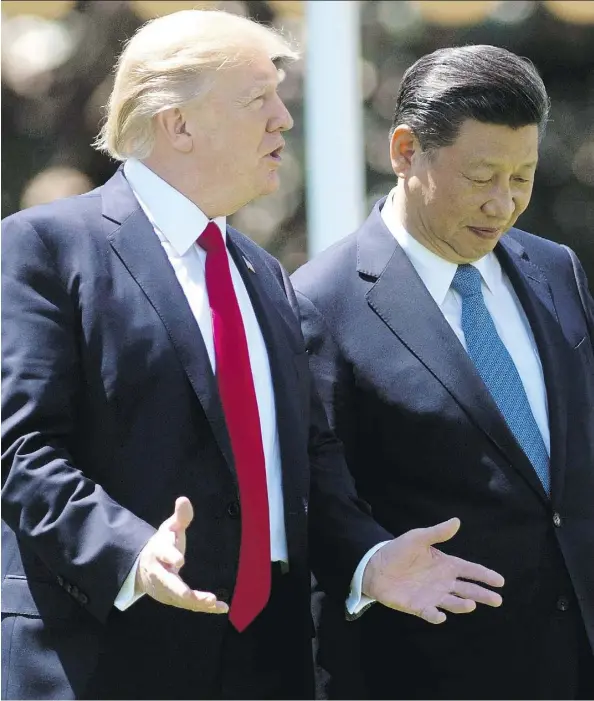  ?? JIM WATSON/AFP/GETTY IMAGES ?? U.S. President Donald Trump’s confrontat­ional talk about America’s trade partners had resonated with many voters on the campaign trail, but he softened his trade stance on China since his meeting last week with Chinese President Xi Jinping, above.