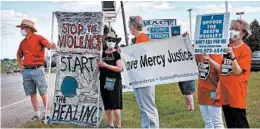  ?? SCOTT OLSON/GETTY ?? Protesters oppose the death penalty Monday near the Terre Haute, Indiana, federal prison, where Daniel Lewis Lee was executed Tuesday after days of legal delays.