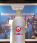 ??  ?? A bottle of water with the logo of Veolia is pictured during the Veolia Innovation Day in Paris.— Reuters
