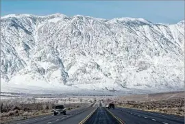  ?? Brian van der Brug Los Angeles Times ?? THE SIERRA Nevada in Round Valley, Calif. Officials are concerned that melting snowpack could f lood the Owens Valley and damage the L.A. Aqueduct.
