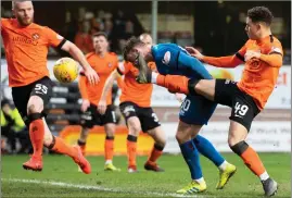  ??  ?? Aaron Doran stoops to head home the winner for Inverness Caley Thistle