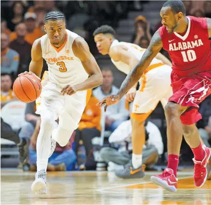  ?? PHOTO BY CALVIN MATTHEIS/KNOXVILLE NEWS SENTINEL ?? Tennessee’s Robert Hubbs III, left, has SEC tournament experience, but many of his teammates don’t. The Vols play their first game at this year’s tournament in Nashville at 1 this afternoon, against Georgia.