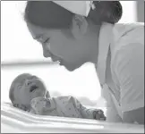  ?? CHEN BIN / XINHUA ?? A newborn baby is taken care of at Gansu Provincial Maternity and Child-care Hospital in Lanzhou in February.