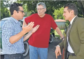  ?? BENMARK HOLZBERG ?? J. J. Abrams, left, and James Franco help bring Stephen King’s fantasy novel to the screen.