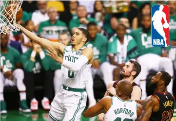  ??  ?? Jayson Tatum (left) of the Boston Celtics drives to the basket in the first half against the Cleveland Cavaliers during Game Five of the NBA Eastern Conference Finals at TD Garden, Massachuse­tts. — AFP photo