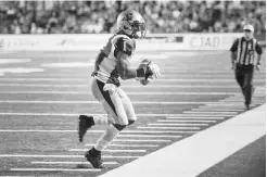  ?? JOHN MAHONEY/ POSTMEDIA NEWS ?? Alouettes receiver Arland Bruce lll makes a catch on the sideline during a recent Canadian Football League game.