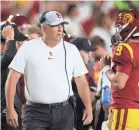  ?? HARRY HOW/GETTY IMAGES ?? Coach Clay Helton and the Trojans suffered a blowout loss to Stanford on Saturday.