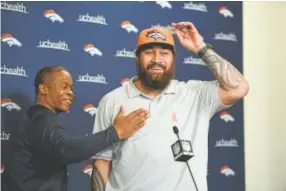  ?? John Leyba, The Denver Post ?? Broncos coach Vance Joseph pats newly signed nose tackle Domata Peko on the chest at Dove Valley on March 13. Since then, the 6-foot-3, 325-pound anchor of the defensive line has made a big impression on the team.