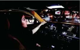  ?? ASSOCIATED PRESS ?? HESSAH AL-AJAJI DRIVERS her car down the capital’s busy Tahlia Street after midnight for the first time in Riyadh, Saudi Arabia, Sunday. Mattis in China as Taiwan, S. China Sea tensions rise