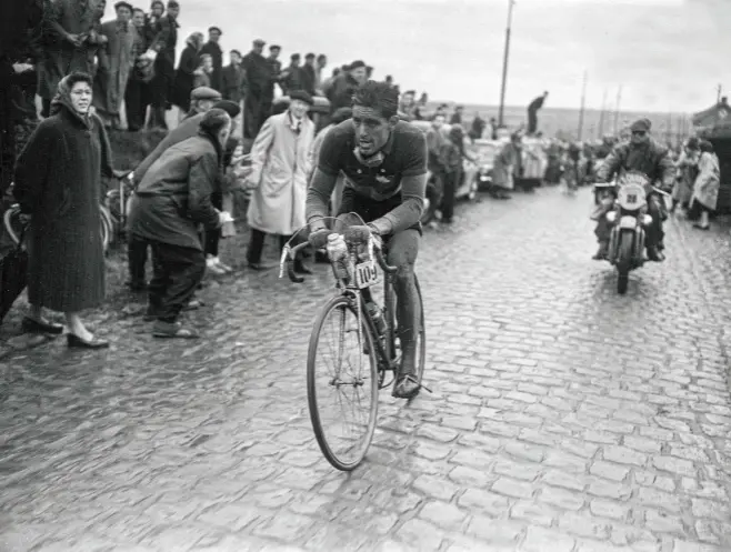  ??  ?? Forestier solos through the cold weather to win at the 1955 Roubaix