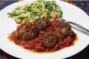  ?? GASSENHEIM­ER/TRIBUNE NEWS SERVICE LINDA ?? Moroccan meatballs with cilantro couscous.