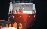  ?? (AP/Firdia Lisnawati) ?? Members of the National Search and Rescue Agency prepare to search for an Indonesian navy submarine Wednesday at Benoa harbor in Bali, Indonesia.