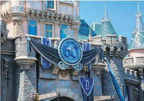  ??  ?? Disney royalty is pulling out all the stops for Disneyland’s 60th anniversar­y in California, with Sleeping Beauty Castle draped in shimmering blue glass crystals. PAUL HIFFMEYER/DISNEYLAND RESORT