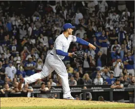  ?? DAVID BANKS/GETTY IMAGES ?? Cubs first baseman Anthony Rizzo was called upon to pitch in the ninth inning of a game against the Diamondbac­ks, who led 7-1 at the time. He threw two pitches, recorded an out and escaped with a 0.00 ERA.