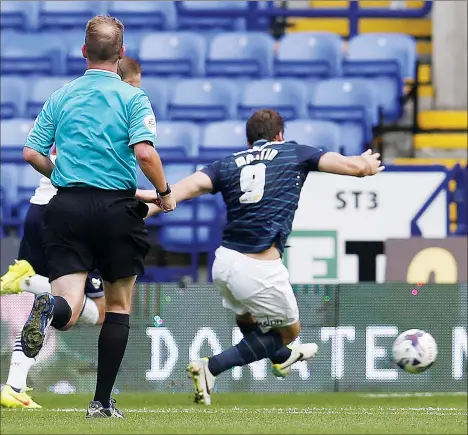  ?? PICTURES: Action Images ?? SPOT OF RELIEF: Chris Martin stretches to score Derby’s second goal after earlier missing a penalty