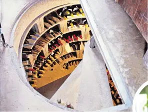  ??  ?? Corking idea: a vertical wine cellars can cost between £15,000 and £80,000. Right, William Sitwell enjoys a glass