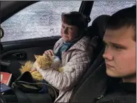  ?? ?? A family fleeing the village of Ruska Lozova arrive April 29 in their shrapnel-ridden car to a screening point in Kharkiv.