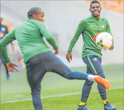  ?? Picture: GALLO IMAGES ?? UP TO TASK: Bafana Bafana captain Thulani Hlatshwayo, right, says they are determined to put up the fight against Nigeria in Uyo on Saturday during the 2019 Africa Cup of Nations qualifier