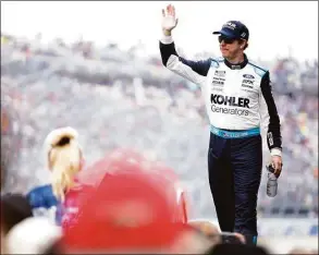  ?? Sean Gardner / Getty Images ?? Brad Keselowski waves to fans during driver intros before the Drydene 400 on May 1 at Dover Motor Speedway in Dover, Del.