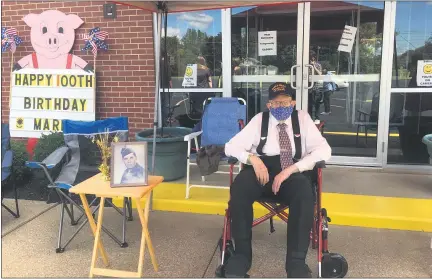  ?? ANDREW CASS — THE NEWS-HERALD ?? Mark Webster, of Painesvill­e Township, awaits the start of the car parade celebratin­g his 100th birthday.