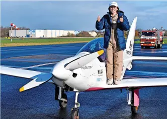  ?? ?? > Belgium-British teenage pilot Zara Rutherford poses with the thumbs up after landing her Shark ultralight plane at the Kortrijk airport in Kortrijk, Belgium. See Q1