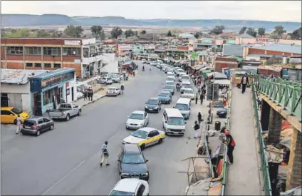  ??  ?? Business as usual: The killings of three senior officers in Maseru this week are thought to be linked to resistance to the prime minister efforts to reduce the powers of the military. Photo: Samson Motikoe/AFP