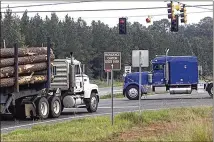  ?? COLUMBUS LEDGER-ENQUIRER ?? Georgia limits commercial trucks to 80,000 pounds with a 5% variance for vehicles carrying certain products. House Bill 189 would expand that variance to 10% — meaning some trucks weighing up to 88,000 pounds could travel on state highways and local roads.