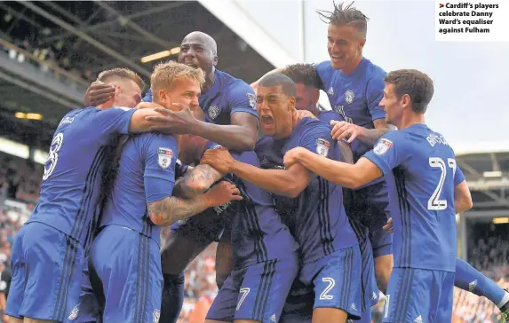  ??  ?? > Cardiff ’s players celebrate Danny Ward’s equaliser against Fulham