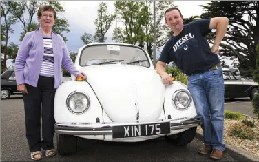  ??  ?? Mrs Bridget Jones, Glountane met Willie O’Connell the current owner of the 1971 VW Beetle which was owned by her late husband, Paddy and in which she learned to drive at that time. They are pictured at the start of the Kingdom Veteran Vintage &amp; Classic Car Club and Honda Charity Run at Ó Riada’s Bar and Restaurant, Ballymacel­ligott on Friday evening.